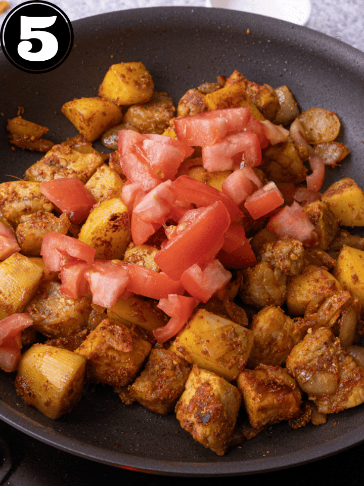 ADD TOMATO TO THE PAN.